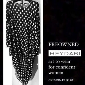 May include: Black and white polka dot tunic dress. The dress has long sleeves and a draped front. The text on the image reads "PREOWNED HEYDARI art to wear for confident women".