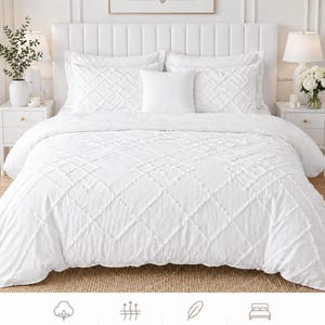 May include: A white bed set with a diamond pattern, including a duvet cover, pillows, and pillowcases. The bedding is displayed on a bed with a white headboard. The image includes text that reads "HOTEL LUXURY SLEEP IN PURE COMFORT" and "PURE WHITE. PURE COMFORT. PURE LUXURY."