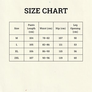 Peut inclure: Un tableau des tailles pour pantalons, avec des mesures en centim&egrave;tres. Le tableau comprend les tailles M, L, XL et 2XL, avec les mesures correspondantes pour la longueur du pantalon, la taille, les hanches et l'ouverture de la jambe.