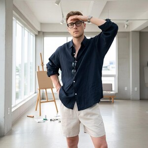 Dark blue linen shirt on man with beige trousers, casual minimalist outfit