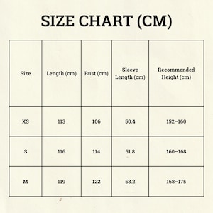May include: A size chart in a grid format, with the text "SIZE CHART (CM)" at the top. The chart includes sizes XS, S, and M, with corresponding measurements for length, bust, sleeve length, and recommended height in centimeters.