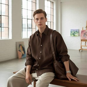 Brown linen cotton long sleeve men’s shirt with leather bag, soft casual fashion look