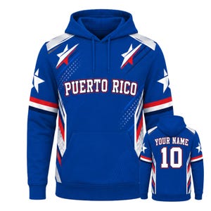May include: A blue hooded sweatshirt featuring the text PUERTO RICO on the front, accented with white stars and red, white, and blue stripes. The back view shows the text YOUR NAME above the number 10, with matching star and stripe patterns.