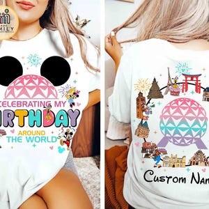 May include: White t-shirt with a colorful design celebrating a birthday. The front features a Mickey Mouse head, a geometric dome, and the text "Celebrating My Birthday Around The World." The back has a similar design with landmarks and the text "Custom Name."