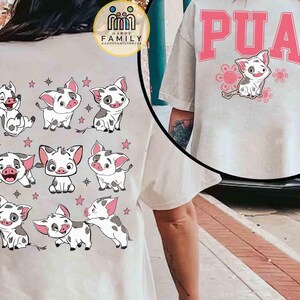 May include: A light-colored t-shirt featuring a cartoon pig design. The back of the shirt displays multiple images of the pig with pink stars. The front of the shirt has the word "PUA" in pink letters above a pig illustration.