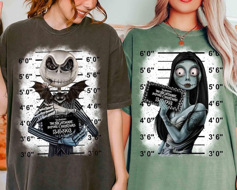 May include: Two t-shirts featuring characters from "The Nightmare Before Christmas." One shirt is dark gray with Jack Skellington holding a sign. The other is green with Sally holding a sign. Both shirts have a mugshot-style background.
