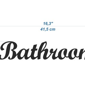 May include: Black cursive text that reads "Bathroom" with measurements in inches and centimeters. The text is 16.3 inches (41.5 cm) wide and 3 inches (7.5 cm) tall.