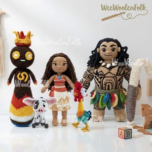 May include: A collection of handmade crochet dolls inspired by the movie Moana. The dolls include characters like Maui, Moana, Hei Hei, and Pua, each with unique details and vibrant colors. The dolls are displayed on a white surface.