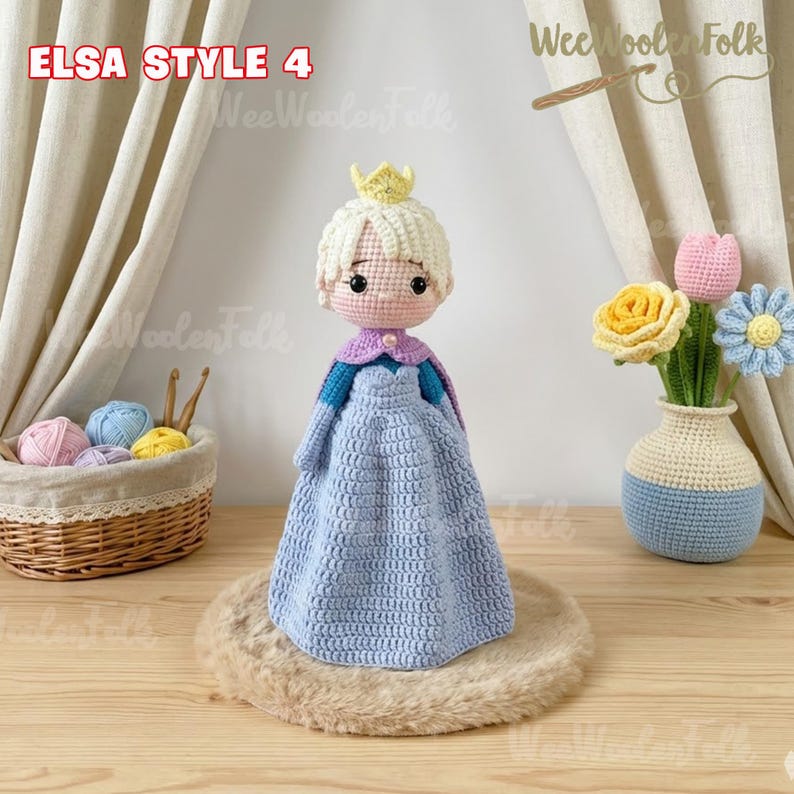 May include: A handmade crochet doll in the style of Elsa from Frozen, with a light blue dress, blonde hair, and a golden crown. The doll is displayed on a round, fluffy, tan surface. The text "ELSA STYLE 4" is visible.