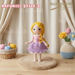 May include: Crocheted doll in a Rapunzel style, featuring a yellow hair, pink and purple dress, and a white collar. The doll is standing on a small, round, brown rug. The text "RAPUNZEL STYLE 3" is visible in the top left corner.