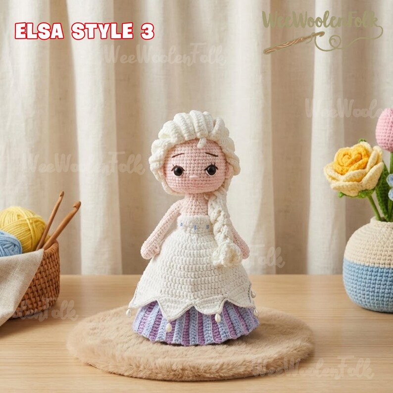 May include: A handmade crochet doll in the style of Elsa, with a white dress and a long, braided hairstyle. The doll has a light skin tone and is displayed on a brown surface. The text "ELSA STYLE 3" is visible in the top left corner.