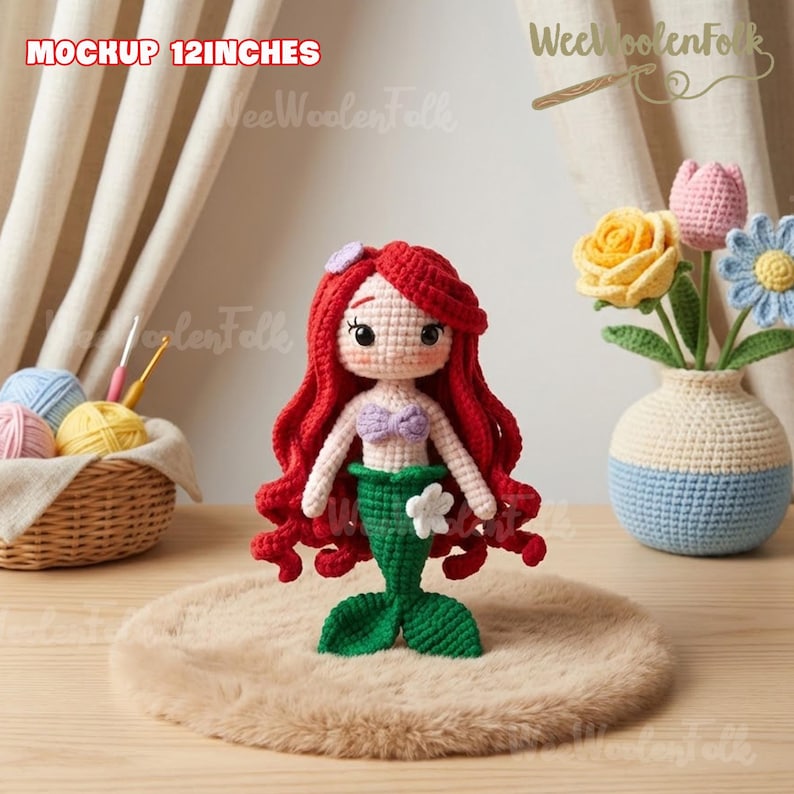 May include: A handmade crochet mermaid doll, approximately 12 inches tall, with vibrant red hair, a lavender top, and a green tail. The doll is displayed on a fluffy, light brown surface. The image also includes a crochet vase with flowers and a basket of yarn.