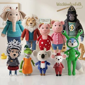 May include: A collection of handmade crochet animal dolls, including an elephant, lion, pig, gorilla, and koala. Each doll is dressed in unique outfits, with vibrant colors and detailed features. The dolls are displayed on a white surface.
