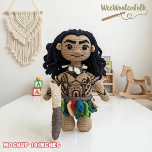 May include: A handmade crochet doll of a character with dark curly hair, a patterned top, and a colorful skirt. The doll is holding a staff and is approximately 14 inches tall.