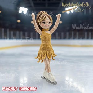 May include: A crocheted figure skater doll with arms raised, wearing a mustard yellow dress and white ice skates. The doll is approximately 12 inches tall. The background shows an ice rink. The text "Mockup 12 inches" is at the bottom.