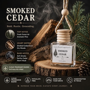 May include: A 10ml glass car air freshener bottle with a wooden cap and hanging cord. The label reads Smoked Cedar, Rustic Breeze Fragrance Co., and Handcrafted. The text lists top, heart, and base notes including forest air, pine, and cedarwood.