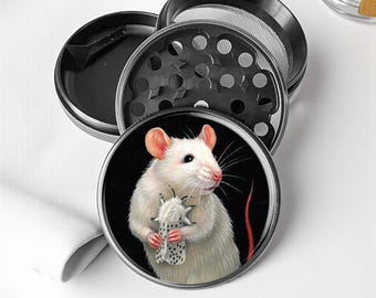 A mouse holding a moth Herb Grinder - Aluminum Spice Grinder