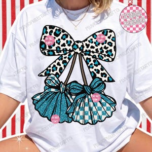 May include: White t-shirt with a bow design. The bow has a black and teal leopard print. Two teal bows with glitter and a checkered pattern are below. The text "DO NOT COPY" is on the design.