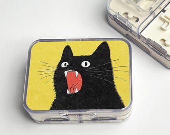 Bärbar pillerlåda med kniv och vintage svart katt