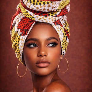 May include: A woman with a vibrant head wrap in red, yellow, and white patterns, styled as a turban. She wears gold hoop earrings. The background is a warm brown colour.