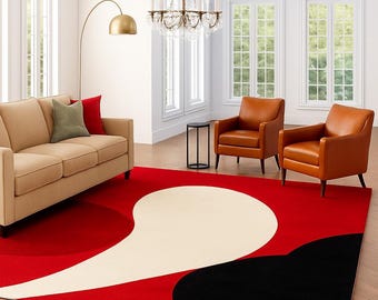 May include: A modern area rug with a bold design. The rug features a vibrant red background with large, abstract shapes in off-white and black. The rug is placed in a living room setting with a sofa and armchairs.