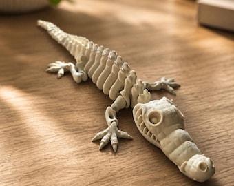 Esqueleto flexible articulado impreso en 3D con forma de cocodrilo