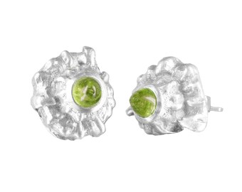 May include: A pair of silver earrings with green gemstone accents. The earrings are shaped like seashells with a textured surface.