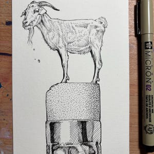 May include: A pen and ink drawing of a goat standing on a pencil eraser. The goat is depicted with detailed linework, highlighting its horns, beard, and fur. A Micron 02 pen is visible on the right side of the image.