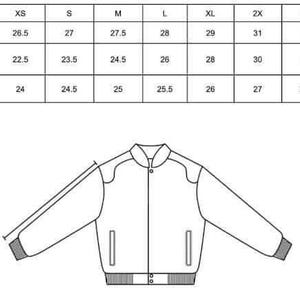 May include: A black and white line drawing of a unisex jacket with a ribbed hem and cuffs. A size chart in inches is displayed above the jacket, detailing measurements for XS to 4X sizes, including center back length, chest width, and sleeve length.