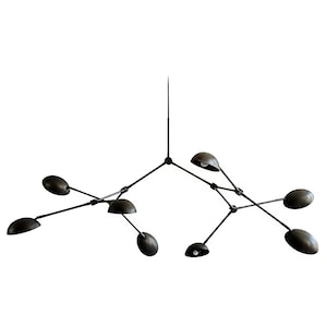 Puede incluir: Un juego de tres tazas de cerámica con un acabado moteado y mate. Las tazas son de color crema, marrón claro y marrón oscuro. Cada taza tiene un diseño simple y minimalista.