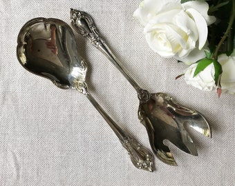 Vintage silverplate serving utensils. About 9 inches long.