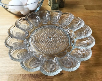 Vintage glass deviled egg plate with room for a relish dish. Hobnail by Indiana Glass. Beautiful on holiday tables and a great hostess gift!