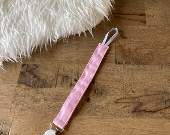Pink soother pacifier clip