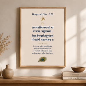 May include: A framed wall art print on a light beige background featuring the text Bhagavad Gita 9.22, an Om symbol, a lotus icon, Sanskrit verses in dark blue, an English translation, and a colorful peacock feather illustration at the bottom.