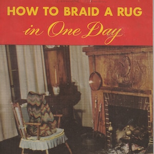 May include: A vintage book cover with the title "HOW TO BRAID A RUG in One Day". The cover features a photo of a braided rug in front of a fireplace in a rustic living room.