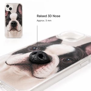 May include: A clear phone case featuring a high-resolution print of a French Bulldog face. The design includes a black, raised 3D nose element that protrudes from the surface, with text indicating a raised 3D nose of approximately 5 mm.
