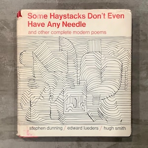 May include: A vintage book cover with the title "Some Haystacks Don't Even Have Any Needle" in red text. The cover features a black and white abstract design. The authors' names are listed at the bottom.