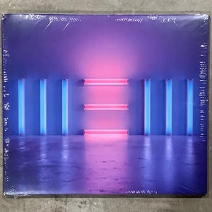 May include: A square vinyl record jacket featuring a vibrant purple and blue gradient background. The artwork displays a series of vertical blue neon light tubes on the sides and three horizontal pink neon light bars centered in the middle.