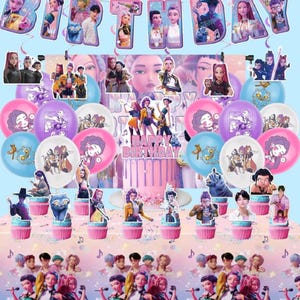 May include: A birthday party decoration set with a cake, balloons, cupcake toppers, and a banner. The decorations are in purple, pink, and blue, with images of a musical group and the words "Happy Birthday".