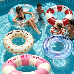 May include: Five inflatable pool floats in a swimming pool. One is clear with blue sections, one is red and white striped with "Custom Text", one is cream with orange hearts and "Custom Text", one is blue with flowers and "Custom Text", and one is pink and white striped with "Ollie's 16th Birthday".
