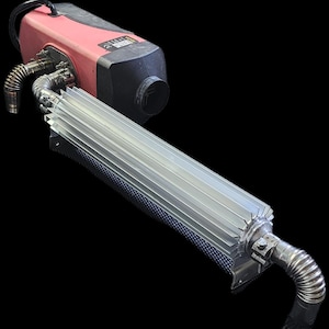 May include: A red and black diesel heater with a silver heat exchanger and flexible metal tubing. The unit has a handle and a black exhaust port. The heat exchanger has a series of parallel fins.