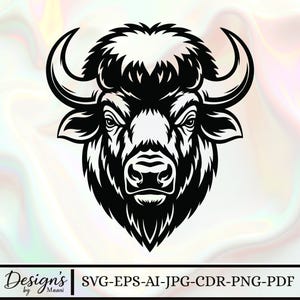 May include: Black and white illustration of a bison head, featuring detailed fur and curved horns. The design has a bold, graphic style. The text "Designs by Maani" and file type options are at the bottom.