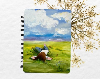 Handmade Journal with Front Cover Made from an Original Painting of a Child Laying in the Green Grass Imagining What Shapes the Clouds Are.