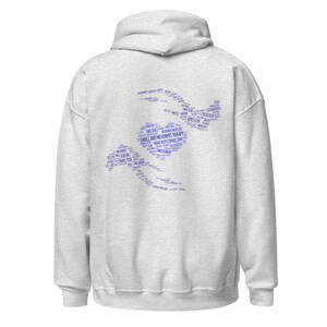May include: A light gray hoodie with a hood and long sleeves. The back of the hoodie features a blue graphic composed of words related to dance and movement therapy, including "Safe Space" and "Expression."