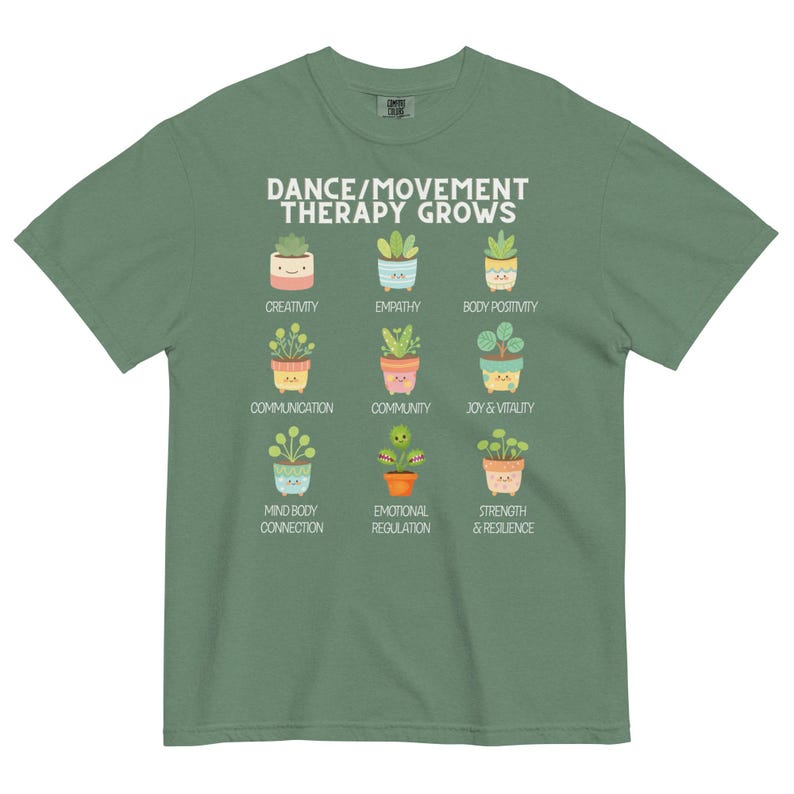 May include: Green t-shirt with the text "DANCE/MOVEMENT THERAPY GROWS" and illustrations of potted plants representing qualities like creativity, empathy, and joy. The shirt is made of a soft, comfortable material.