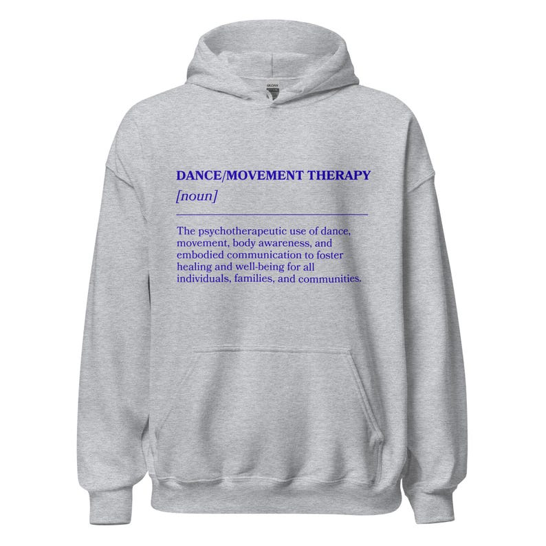May include: A light gray hoodie with the text "DANCE/MOVEMENT THERAPY [noun]" in blue. The text below describes the psychotherapeutic use of dance, movement, body awareness, and embodied communication to foster healing and well-being.