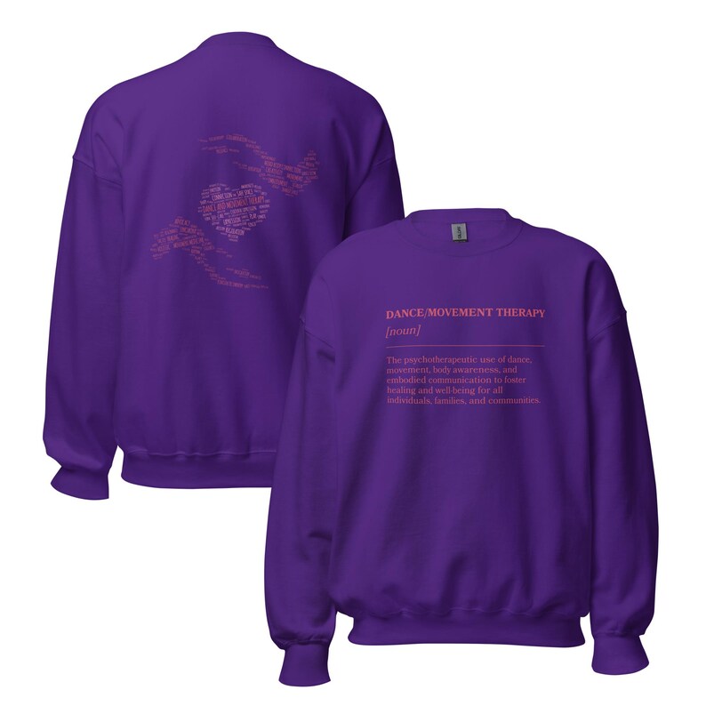 May include: A purple sweatshirt with the text "DANCE/MOVEMENT THERAPY" in pink. The definition of dance movement therapy is printed below the title. The back of the sweatshirt has a pink heart design with words.