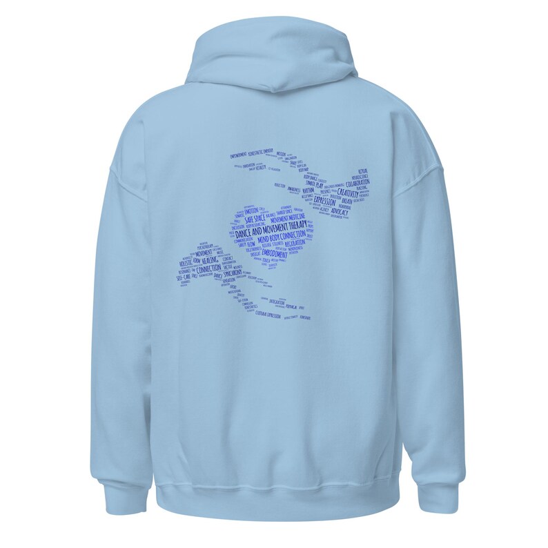 May include: A light blue hoodie with a hood and long sleeves. The back of the hoodie features a blue graphic composed of words related to dance and movement therapy, arranged in a stylized shape.