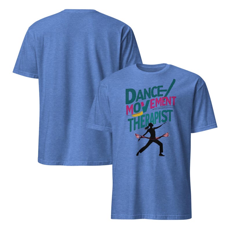 May include: Two blue t-shirts. The front shirt has the words "DANCE MOVEMENT THERAPIST" in teal, pink, and yellow. A black silhouette of a person dancing with two props is below the text. The back of the shirt is plain.
