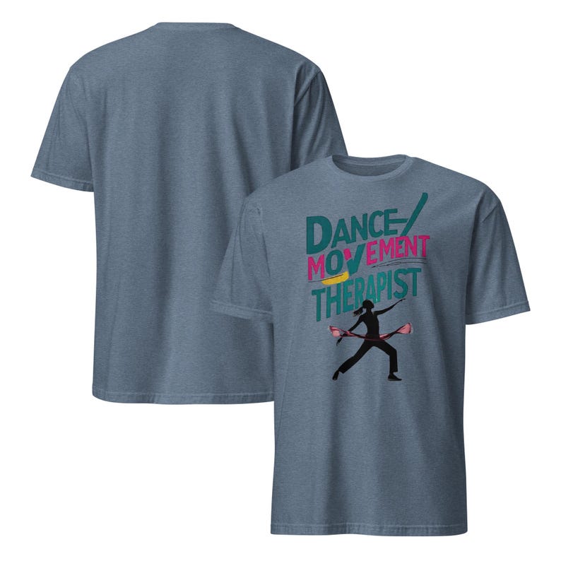 May include: Two blue t-shirts. The front shirt has the words "DANCE MOVEMENT THERAPIST" in teal, pink, and yellow. A black silhouette of a person with two props is below the text. The back of the shirt is plain.
